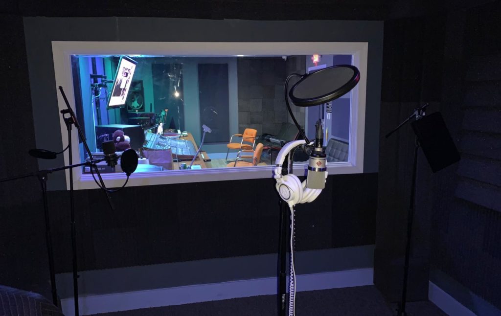 Voice-over microphone and pop filter in the Rare Monkey Studios booth